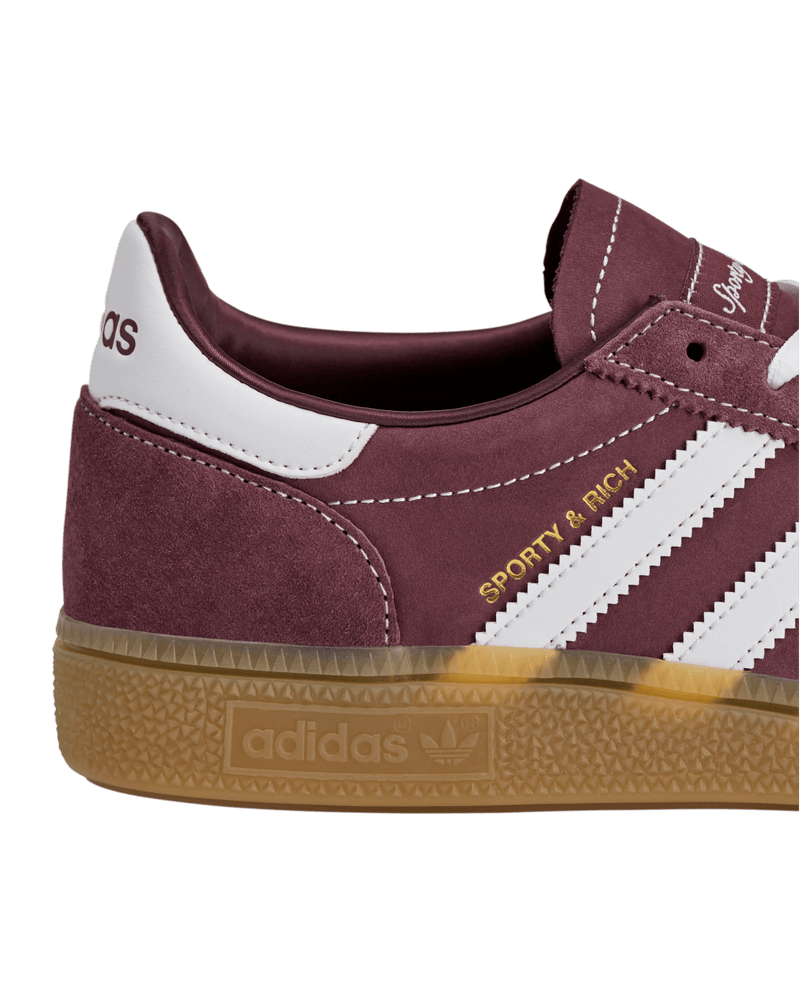 Side profile close-up of the adidas x Sporty & Rich Handball Spezial sneaker in Shadow Red suede with gum sole.