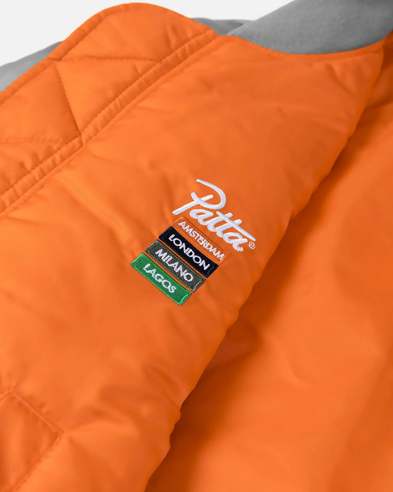 Embroidered Patta logo and chapter cities on the orange lining of the MA-1 bomber jacket.