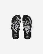 Top view of black Patta x Havaianas rubber flip-flops featuring bold white script logo graphics.