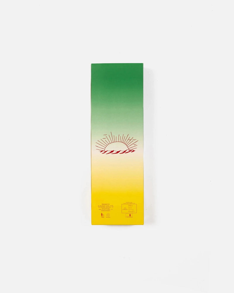 Patta x Havaianas green and yellow gradient shoe box with a printed sunrise graphic.