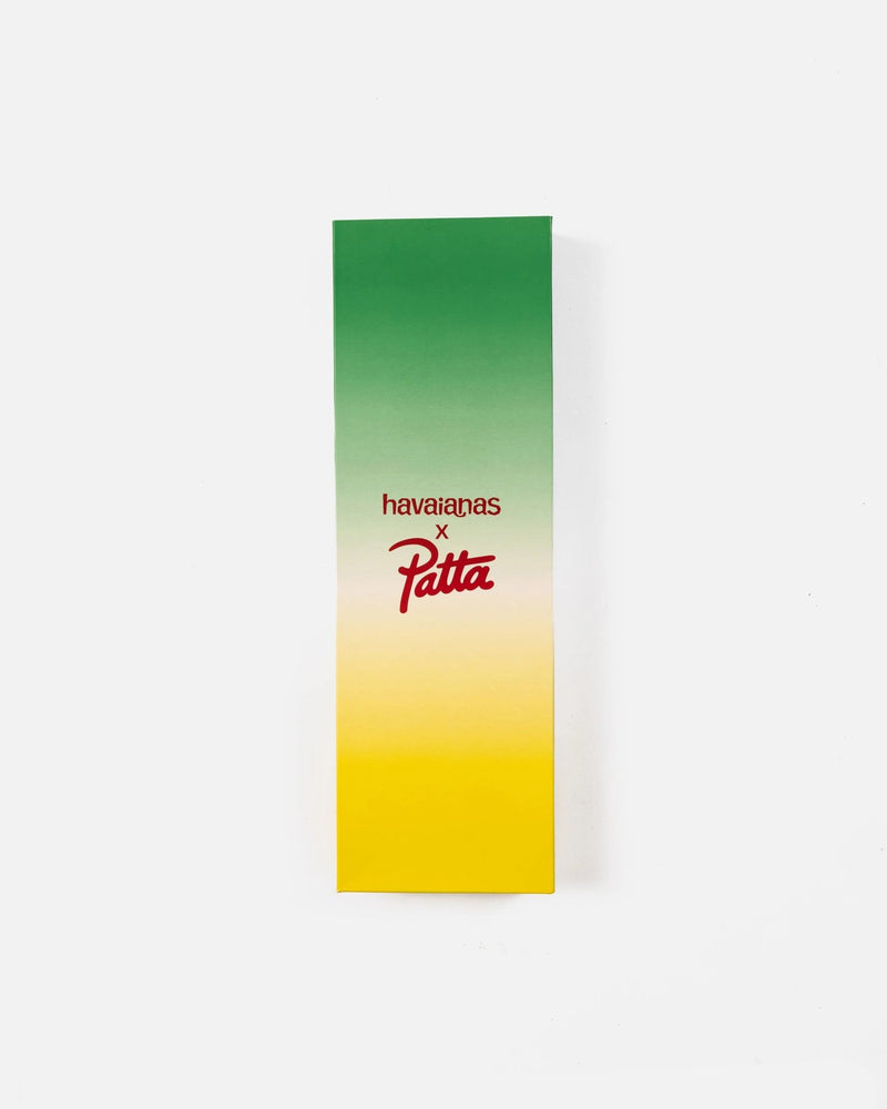 Green and yellow gradient custom shoebox featuring the Patta x Havaianas collaboration logo.