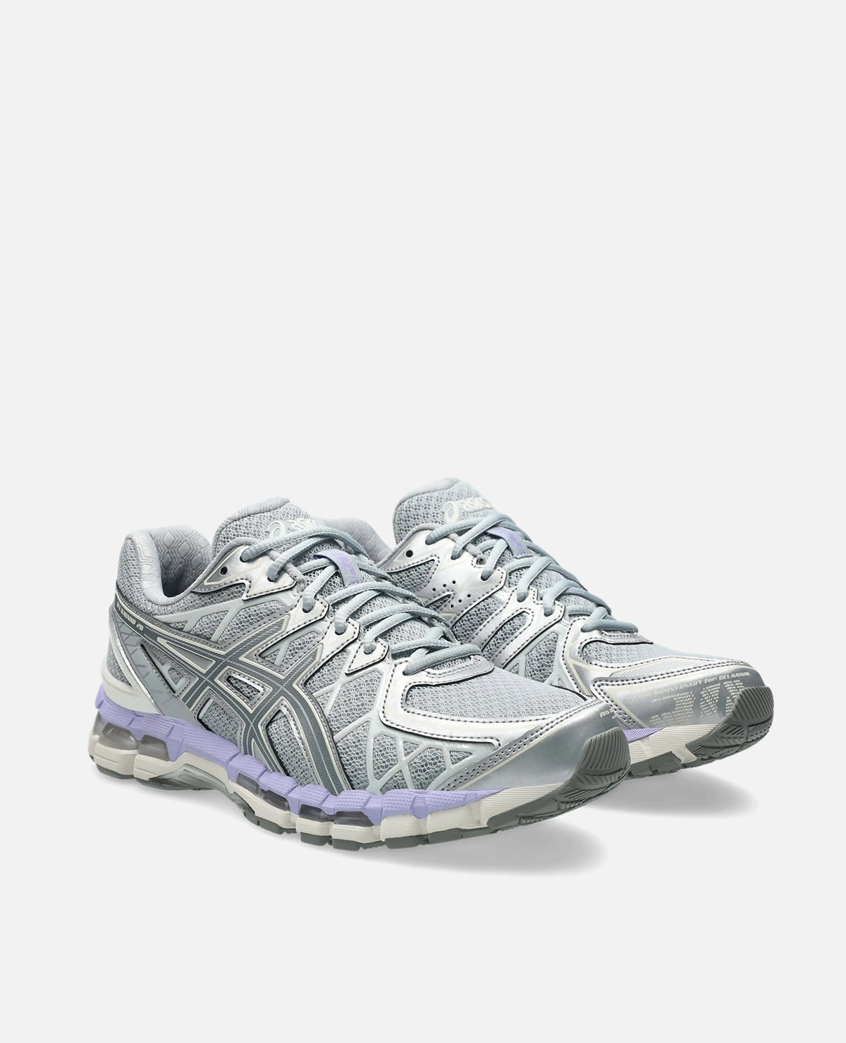 Asics Gel-Kayano 20 sneakers in Piedmont Grey and silver mesh with purple accents in a three-quarter view.