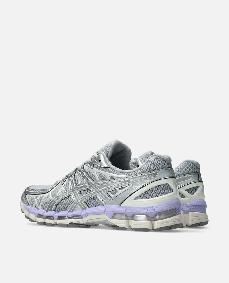 Rear view of Asics Gel-Kayano 20 sneakers in Piedmont Grey mesh with silver overlays and lavender GEL cushioning.
