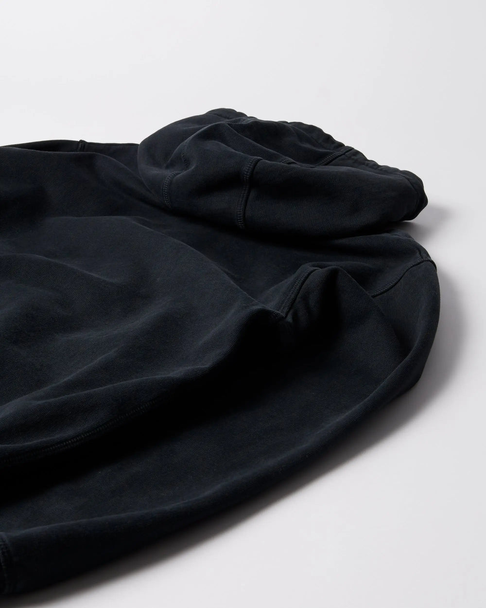 Close-up detail of the hood and seams on the ByParra Connected Guy Hooded Sweatshirt in black.