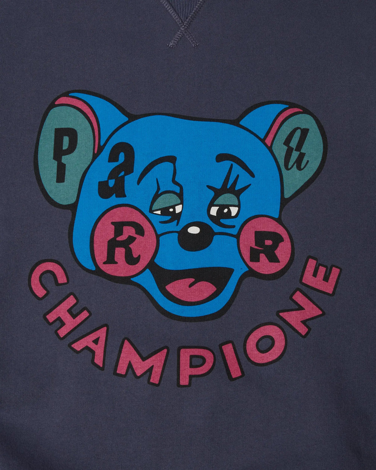 Close-up of the Tired Champione graphic print on a navy blue byParra crewneck sweatshirt.