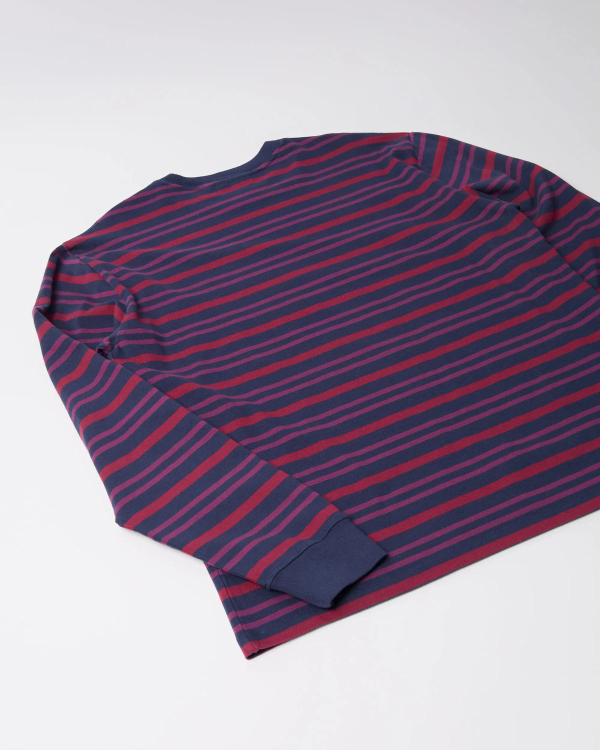 Back view of the byParra 1992 purple striped long sleeve t-shirt laid flat.