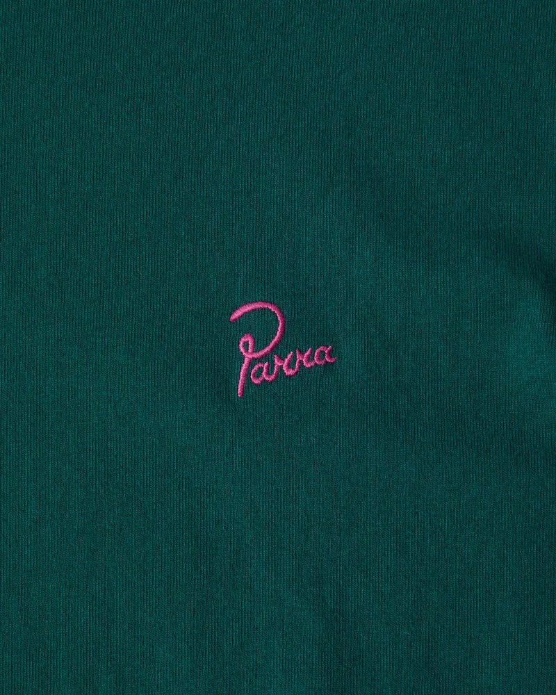 Close-up of pink embroidered Parra signature logo on a dark green cotton T-shirt.