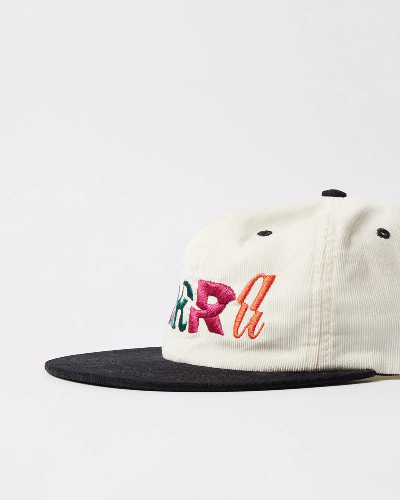 Side profile of the byParra Error Logo corduroy 6-panel hat in off white with a black brim and colorful embroidery.
