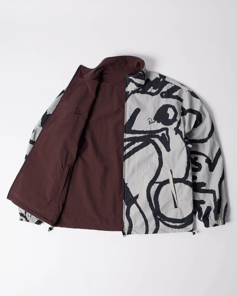 byParra Freak Scene Reversible Track Top in grey with black graphic print, open to show brown lining.
