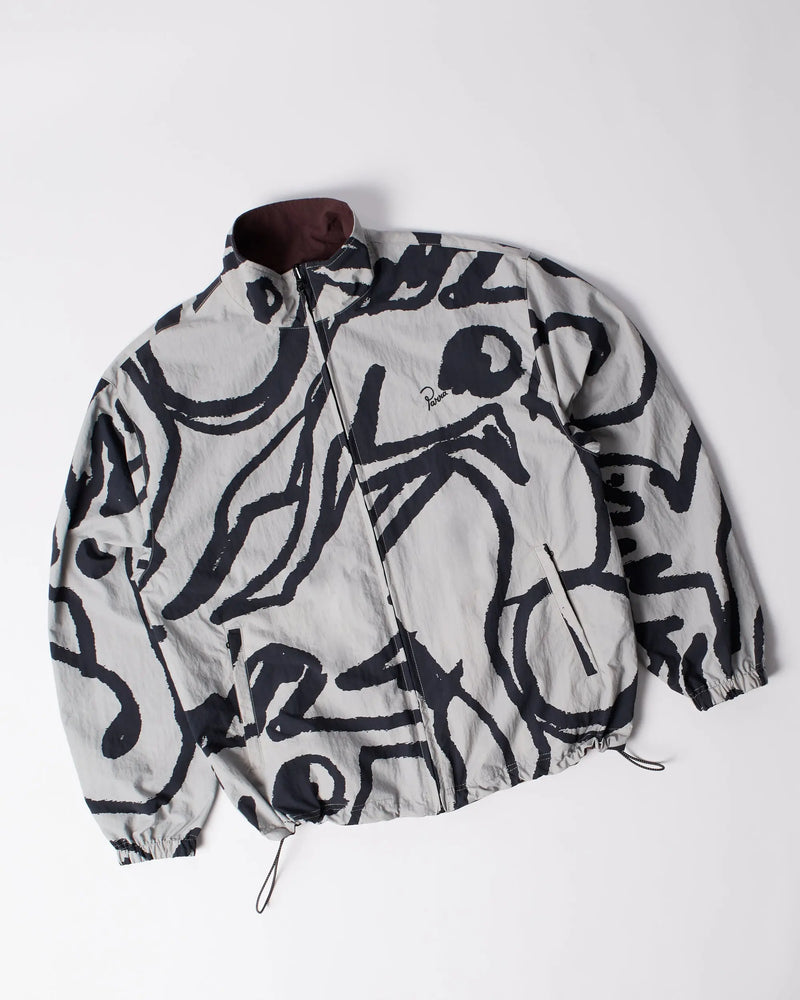 byParra Freak Scene reversible track top in grey featuring an abstract black pattern laid flat.
