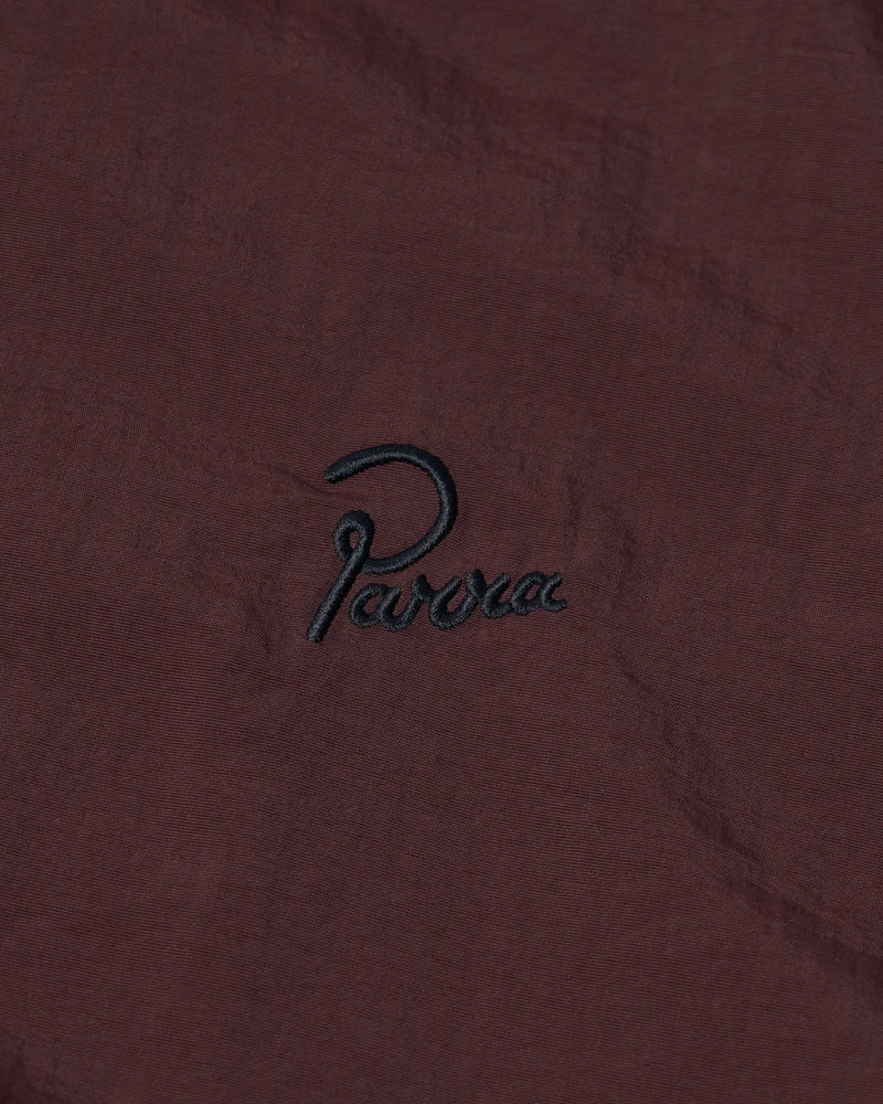 Embroidered black Parra script logo on the brown side of byParra Freak Scene Reversible Track Top.
