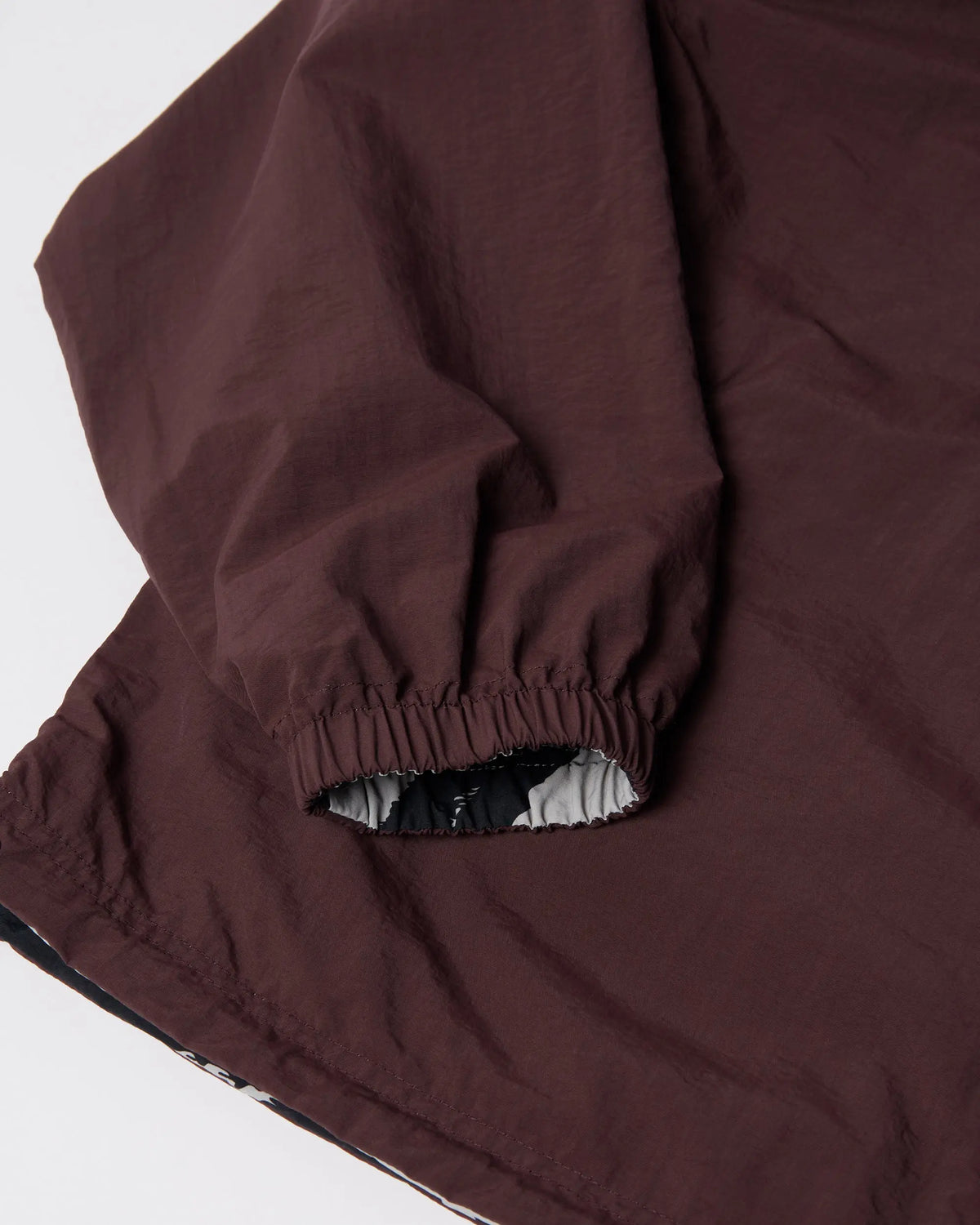 Elastic cuff and inner lining detail of the byParra Freak Scene Reversible Track Top.