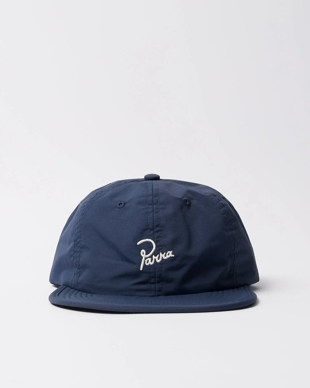 Front view of the blue byParra Signature 6 Panel nylon cap with white embroidered logo.