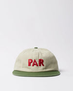 byParra Paper Par 6-panel hat in beige cotton twill with a green brim and red embroidered PAR text.