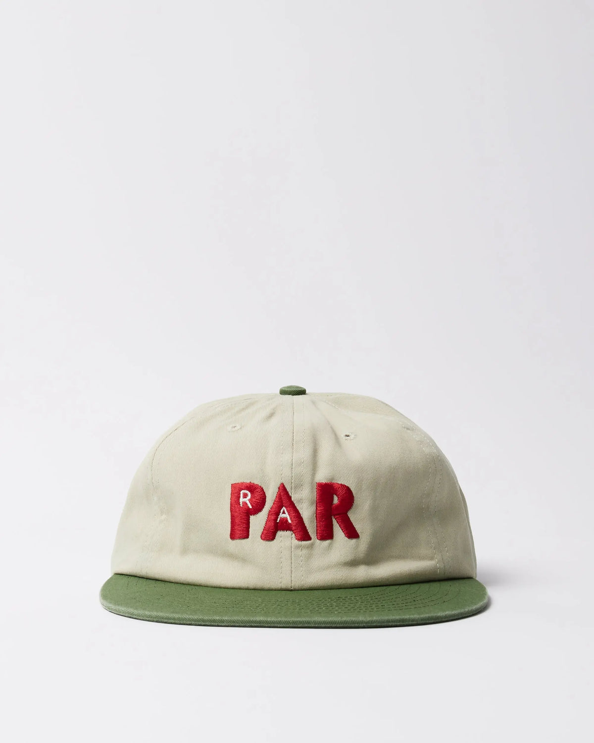 byParra Paper Par 6-panel hat in beige cotton twill with a green brim and red embroidered PAR text.