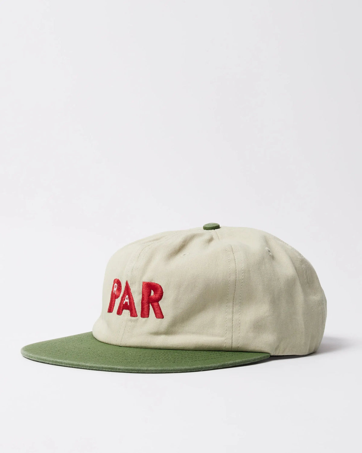 byParra Paper Par 6-panel hat in beige with a green brim and red embroidered logo.