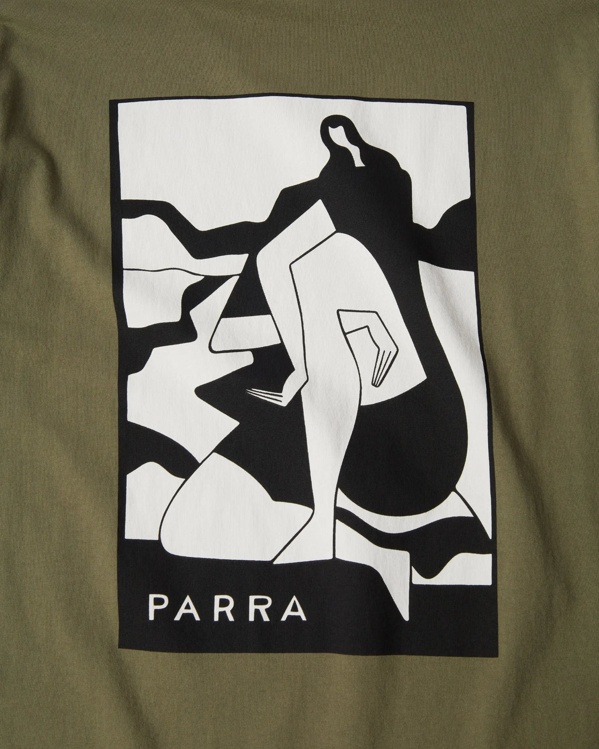 Close-up of black and white abstract graphic print on the green By Parra Waiting for you t-shirt.