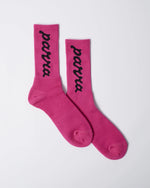 By Parra hot pink ribbed crew socks with black lowercase script logo detailing.