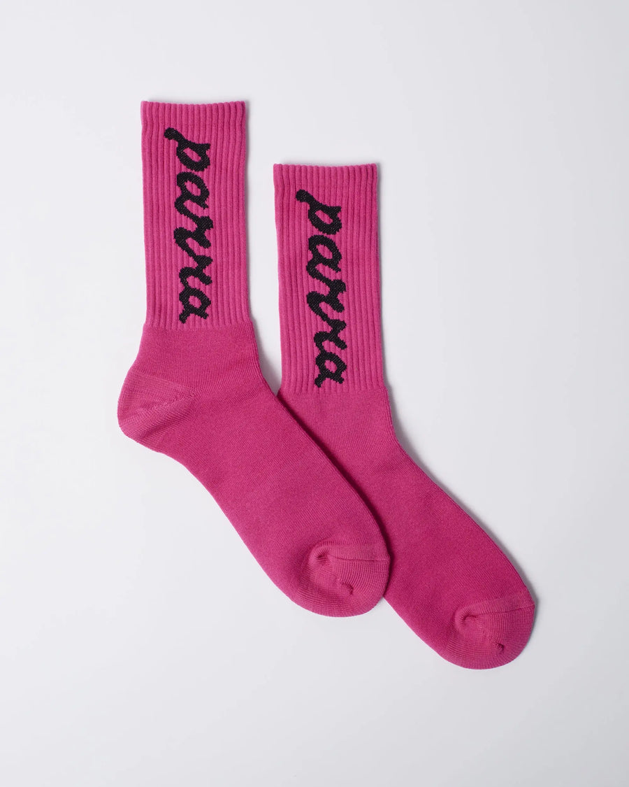 By Parra hot pink ribbed crew socks with black lowercase script logo detailing.