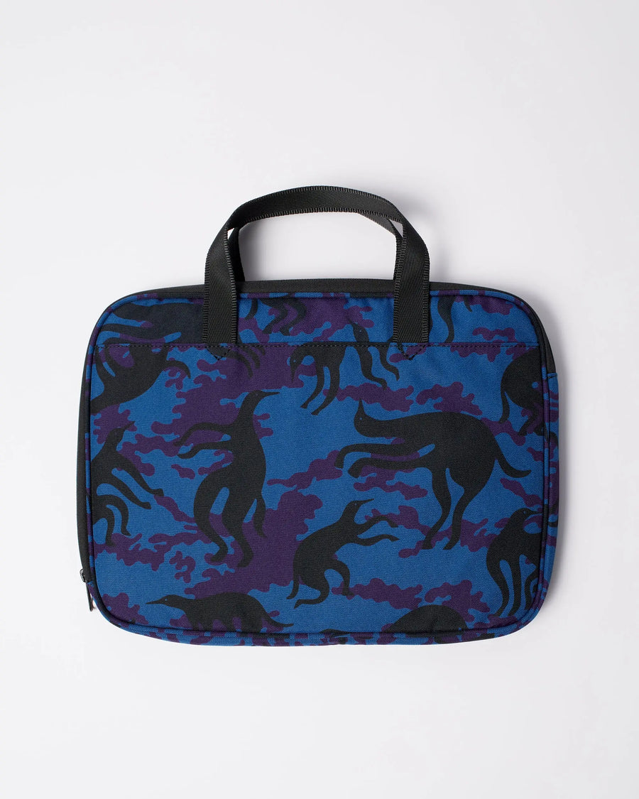 By Parra Purple Camo Beast laptop sleeve in blue with black handles and graphic camo print.