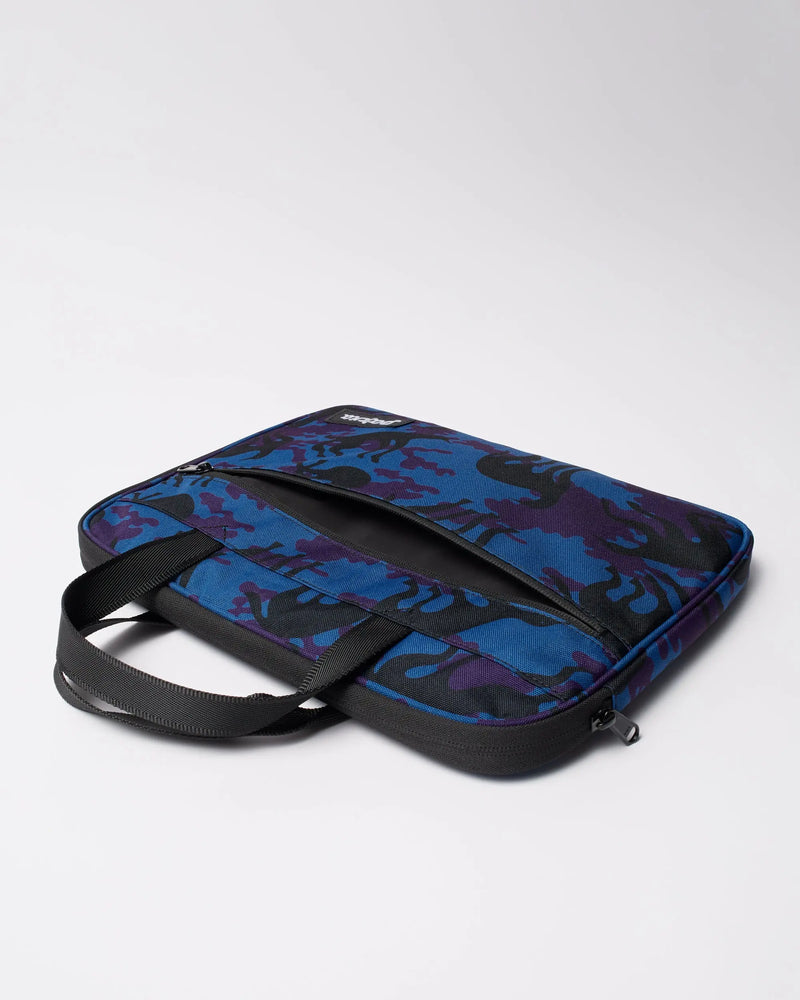 By Parra Purple Camo Beast laptop sleeve in blue showing the zippered front compartment and handles.