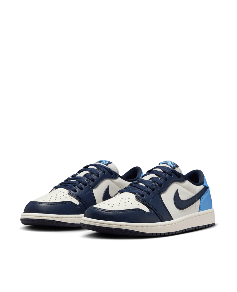 Air Jordan 1 Low OG sneakers in Obsidian and University Blue leather on a black backdrop.