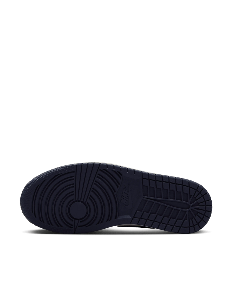 Dark obsidian rubber outsole and tread pattern of the Air Jordan 1 Low OG sneaker.