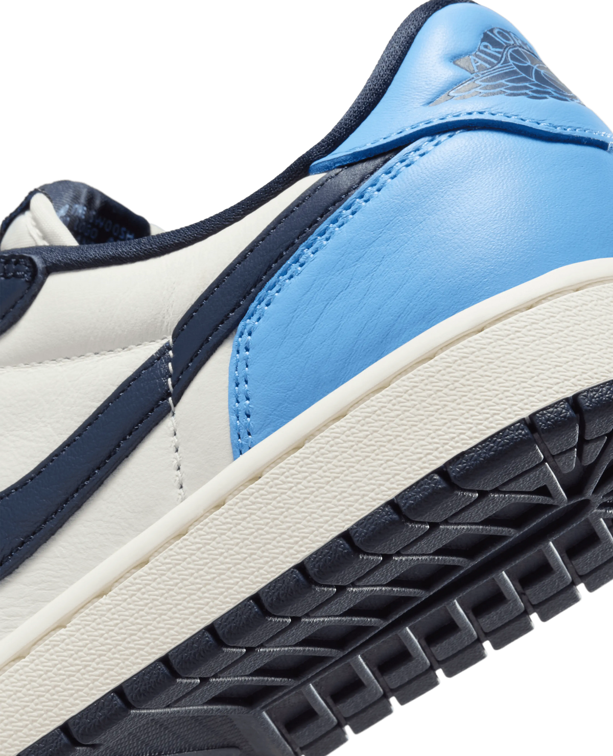 Close-up of the Air Jordan 1 Low OG heel featuring University Blue leather, Wings logo, and sail midsole.
