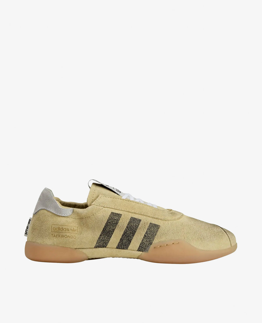 Side profile of the adidas x Song For The Mute Taekwondo Mei sneaker in cream white suede with black 3-Stripes.