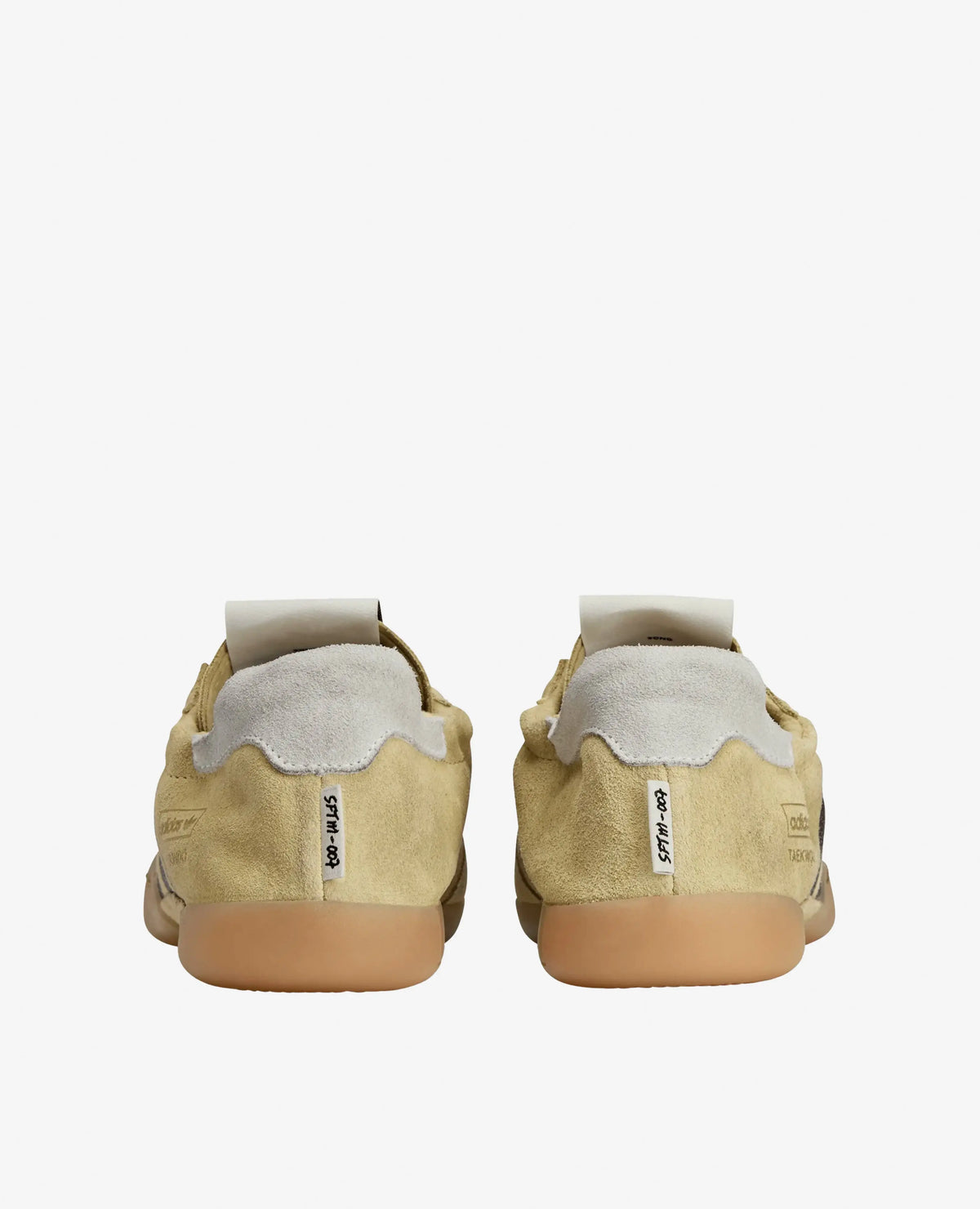 Rear view of adidas x Song For The Mute Taekwondo Mei sneakers in cream suede with gum outsoles.