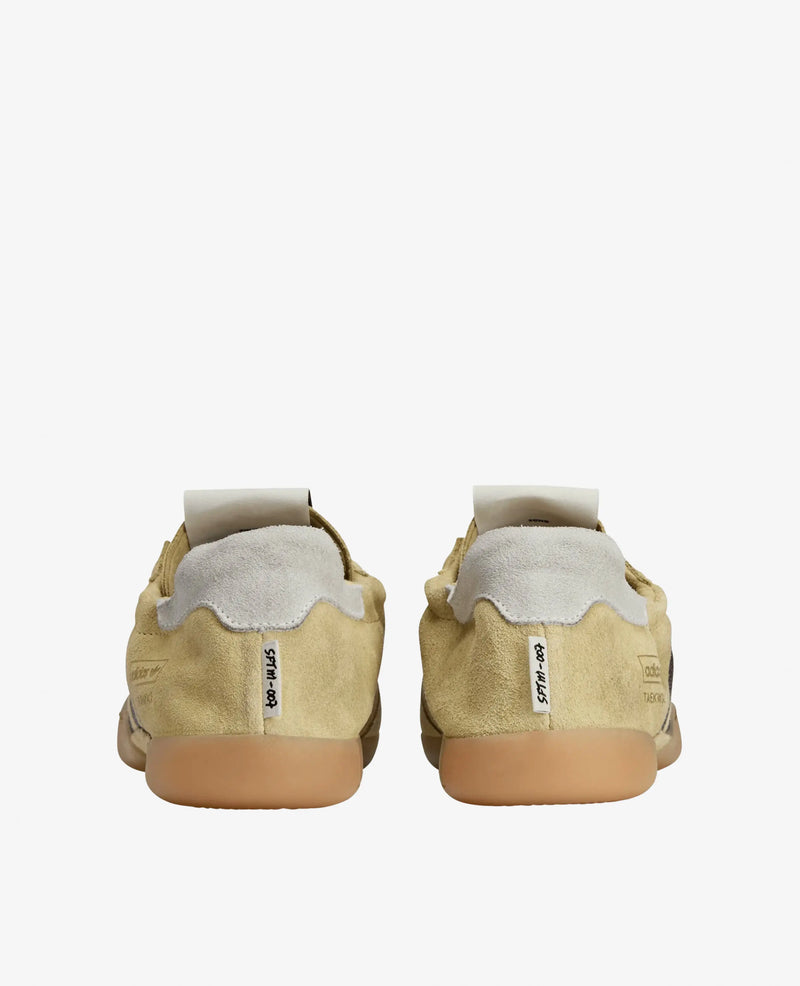 Rear view of adidas x Song For The Mute Taekwondo Mei sneakers in cream suede with gum outsoles.