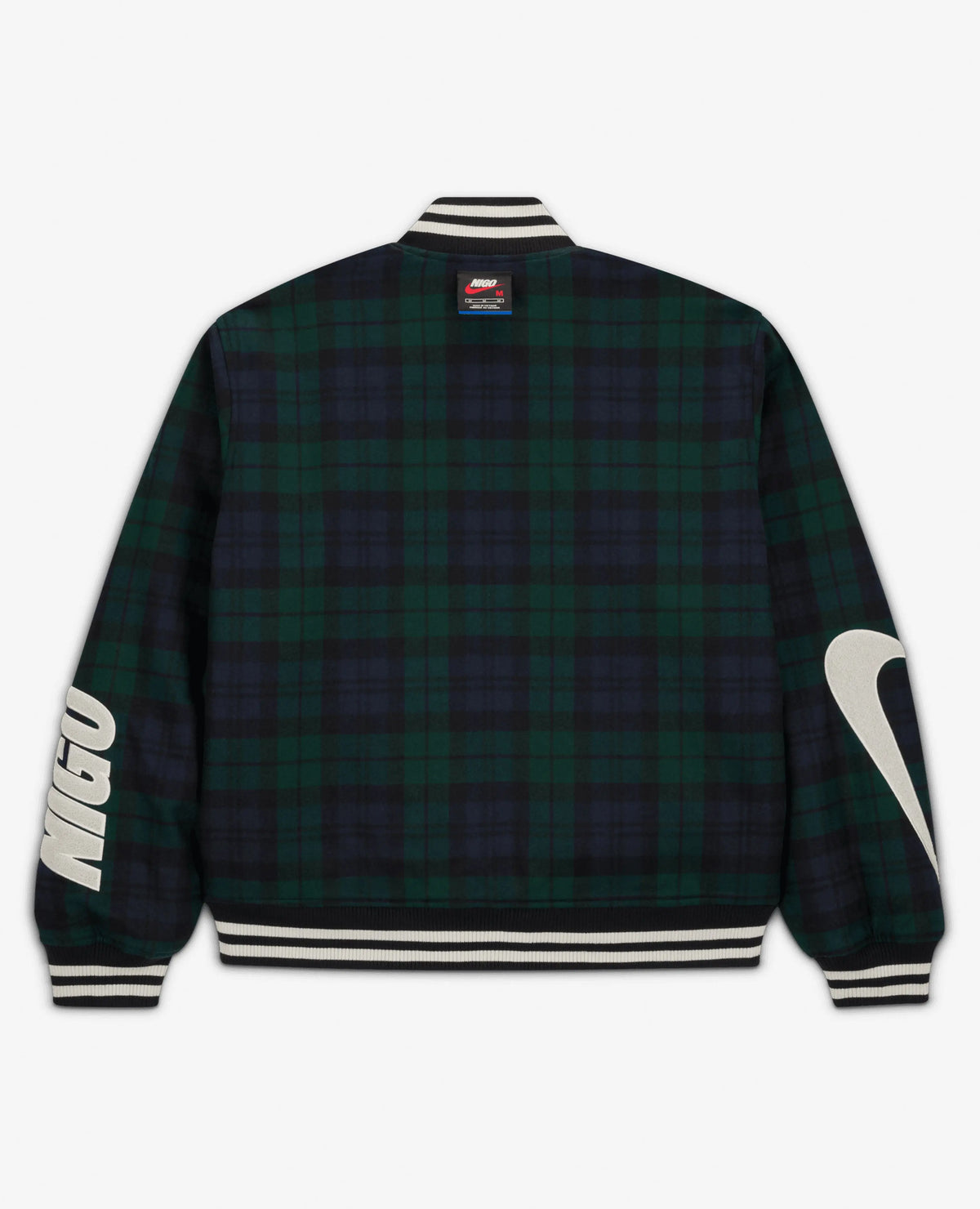 Back view of the Nike x NIGO NRG jacket in forest green plaid with bold sleeve patches.