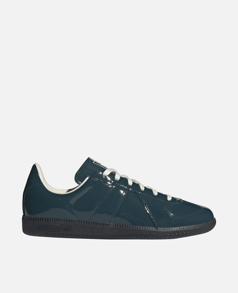 Side view of the adidas BW Army sneaker featuring a glossy dark teal patent leather upper and dark sole.
