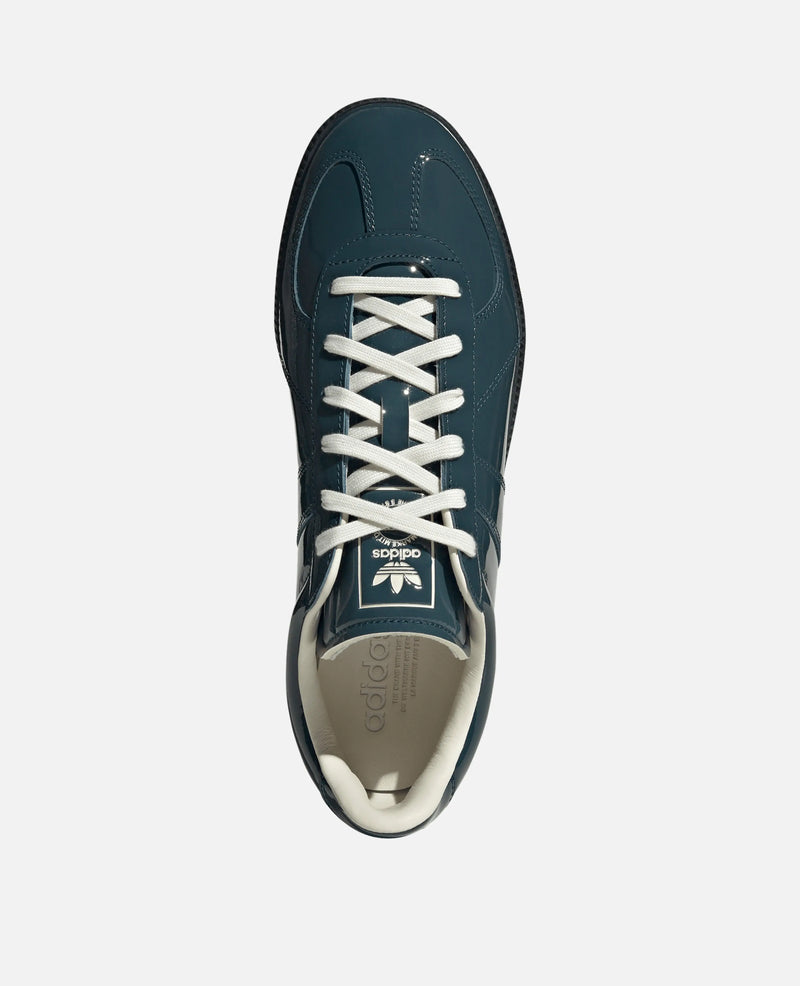 Top-down view of the adidas BW Army sneaker in glossy dark teal patent leather with white laces.