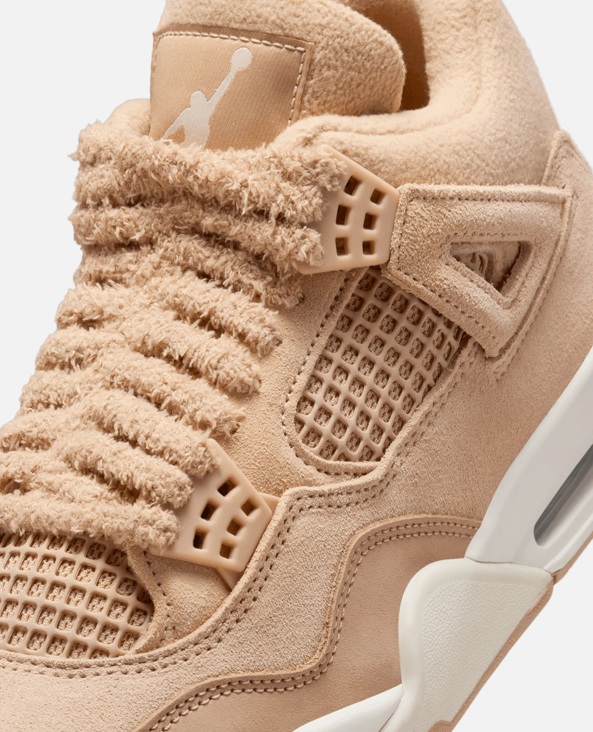 Close-up of Nike WMNS Air Jordan 4 Retro Tex in Hemp featuring textured fleece laces and suede details.