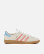 adidas München 24 sneaker in wonder white suede with pink stripes, light blue heel, and gum sole.