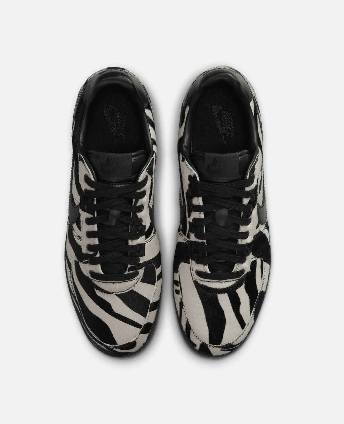 Top-down view of Nike Field General Premium sneakers in black and white zebra print.