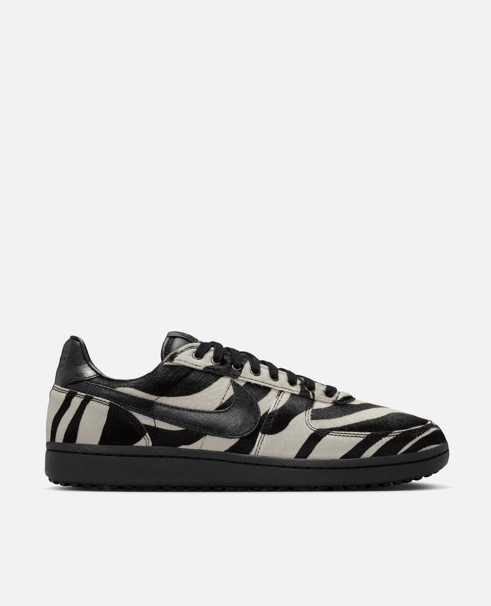 Side profile of Nike Field General Premium sneaker in zebra print pony hair with black leather details.