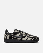 Side profile of Nike Field General Premium sneaker in zebra print pony hair with black leather details.