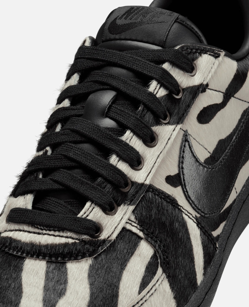 Close-up of Nike Field General Premium sneaker in zebra faux fur with black laces and leather Swoosh.