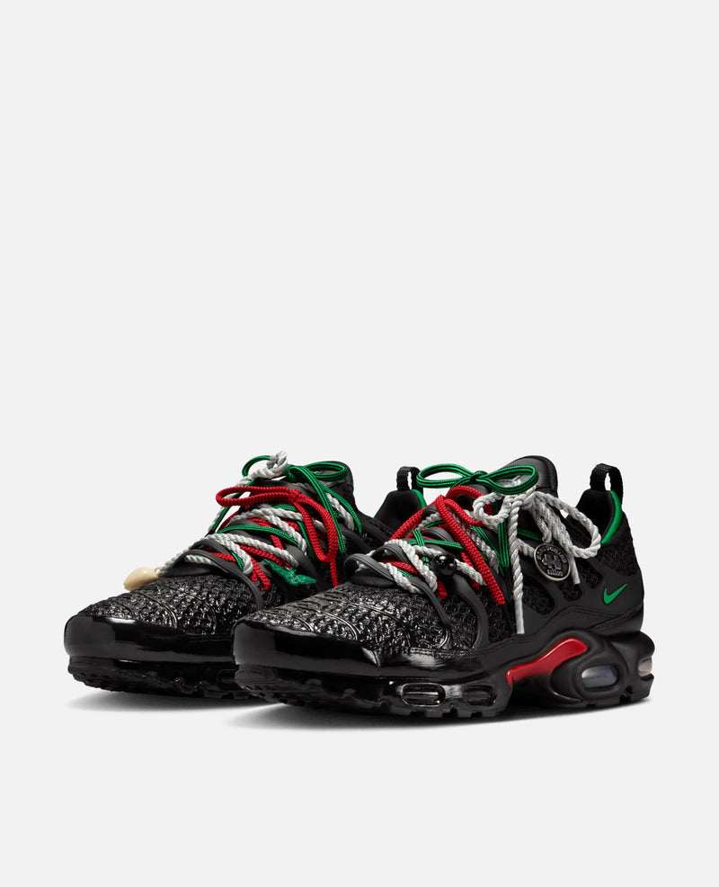 HOMECOMING x Nike Air Max Plus Pan African sneakers in black with red, green, and white rope laces.