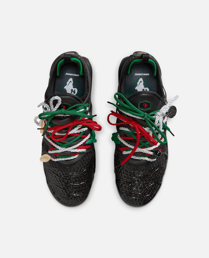 Top-down view of HOMECOMING x Nike Air Max Plus Pan African sneakers with textured uppers and colorful laces.