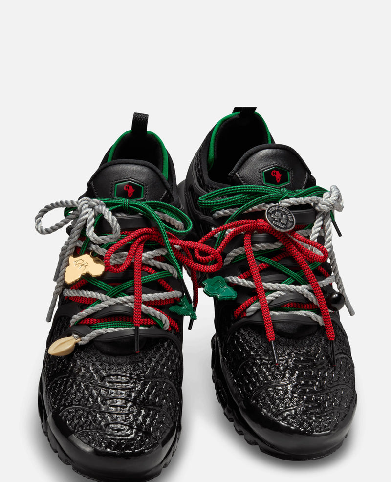 Front view of HOMECOMING x Nike Air Max Plus Pan African sneakers with multicolored layered rope laces.
