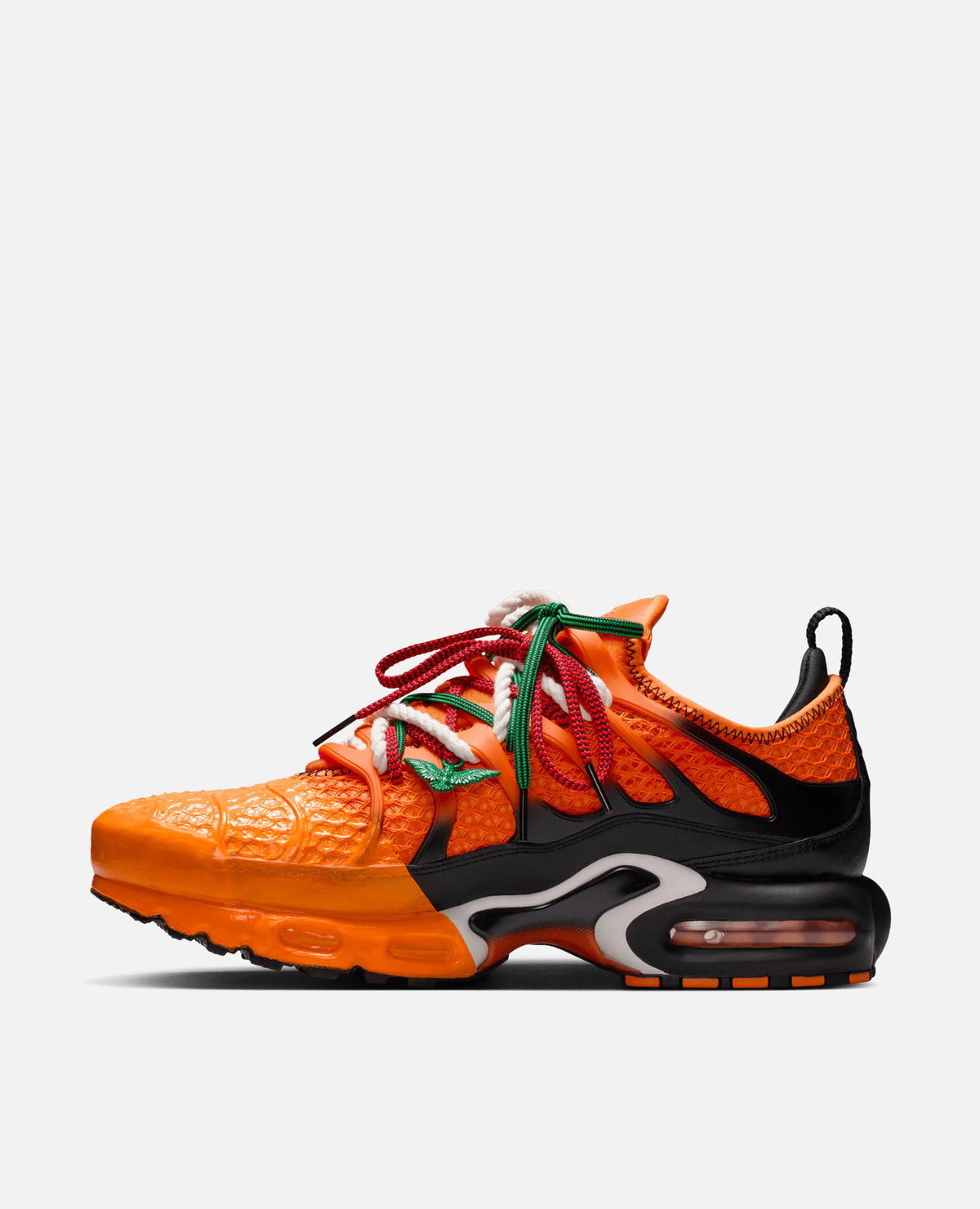HOMECOMING x Nike Air Max Plus in Safety Orange and black featuring multi-colored laces in a side profile view.