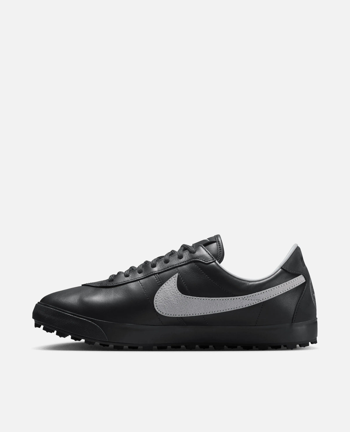 Side profile of the Nike Astrograbber leather sneaker in Off Noir with a Cement Grey Swoosh.