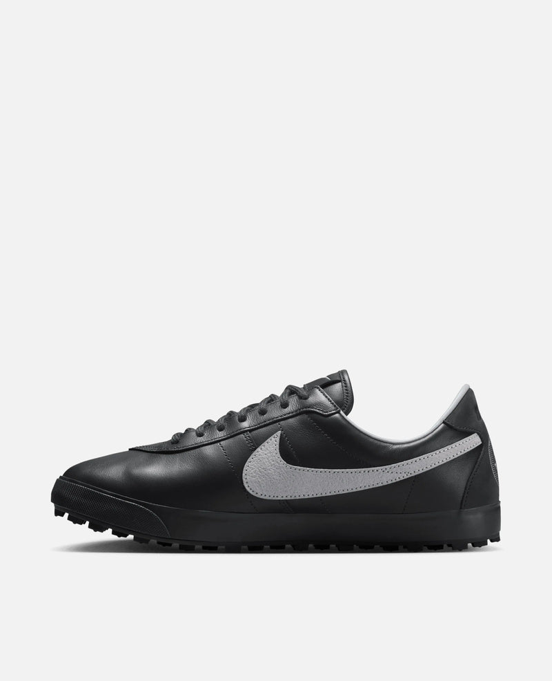 Side profile of the Nike Astrograbber leather sneaker in Off Noir with a Cement Grey Swoosh.