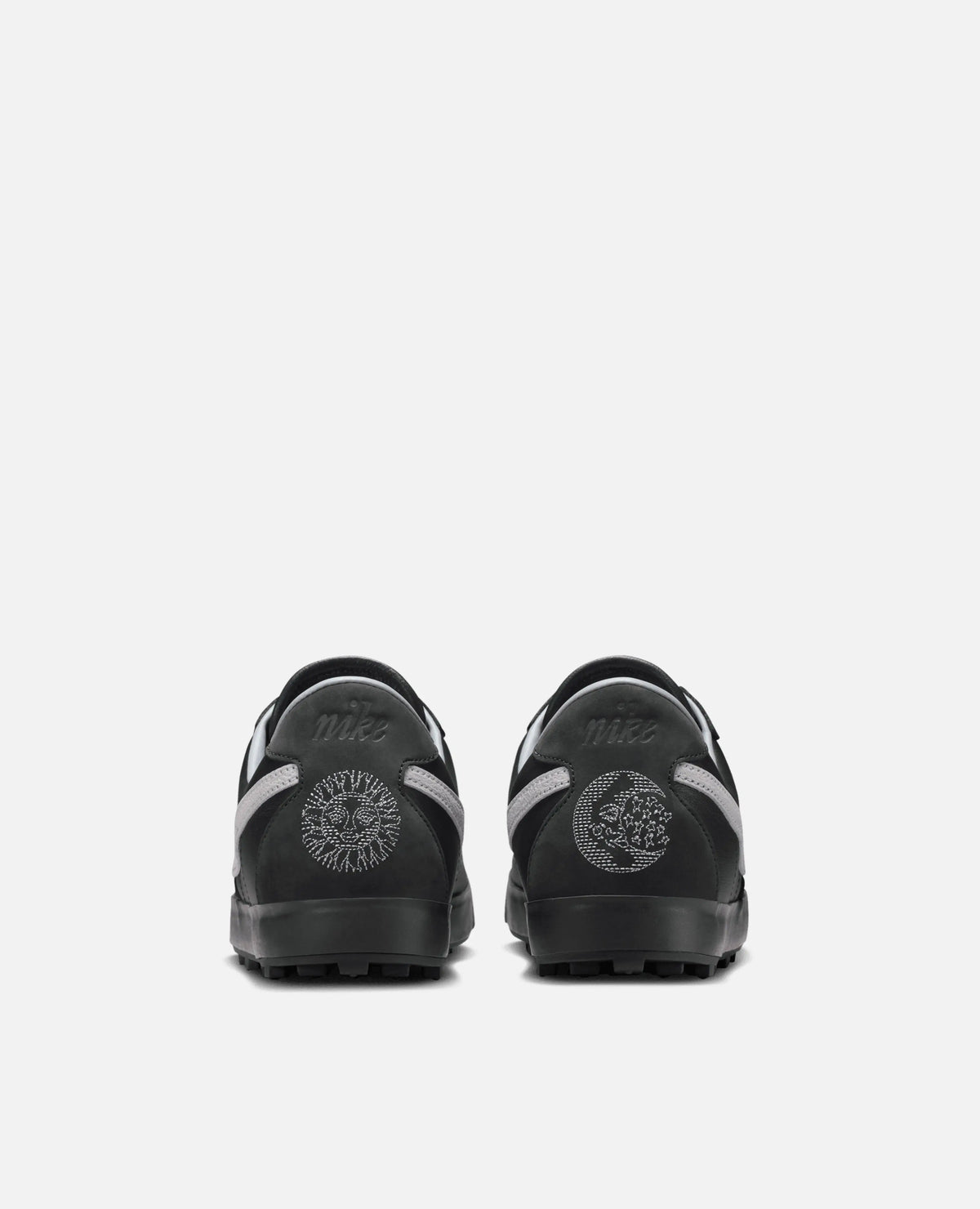 Rear view of Nike Astrograbber in Off Noir featuring embroidered sun and moon graphics on the heels.