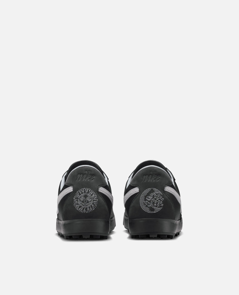 Rear view of Nike Astrograbber in Off Noir featuring embroidered sun and moon graphics on the heels.