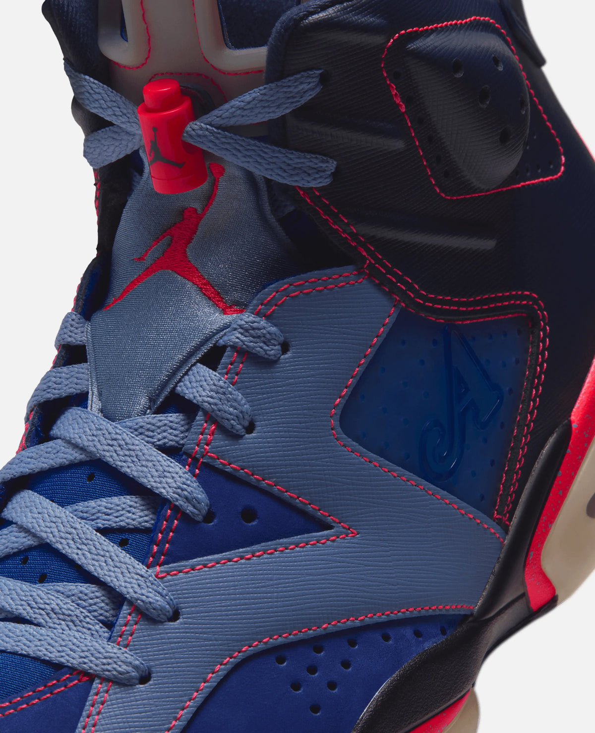 Close-up of the Air Jordan 6 Retro SP x Awake NY sneaker with red contrast stitching and lace lock.