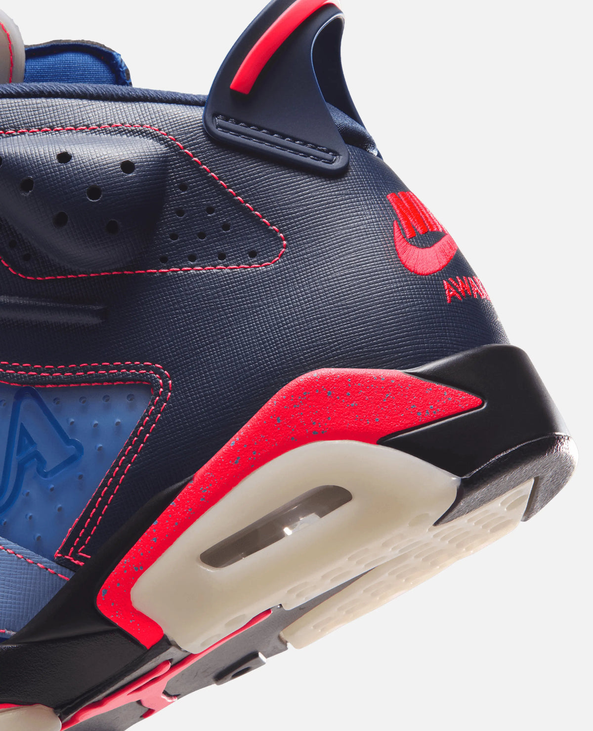 Close-up of Air Jordan 6 Retro SP x Awake NY heel in midnight navy with red speckled midsole accents.